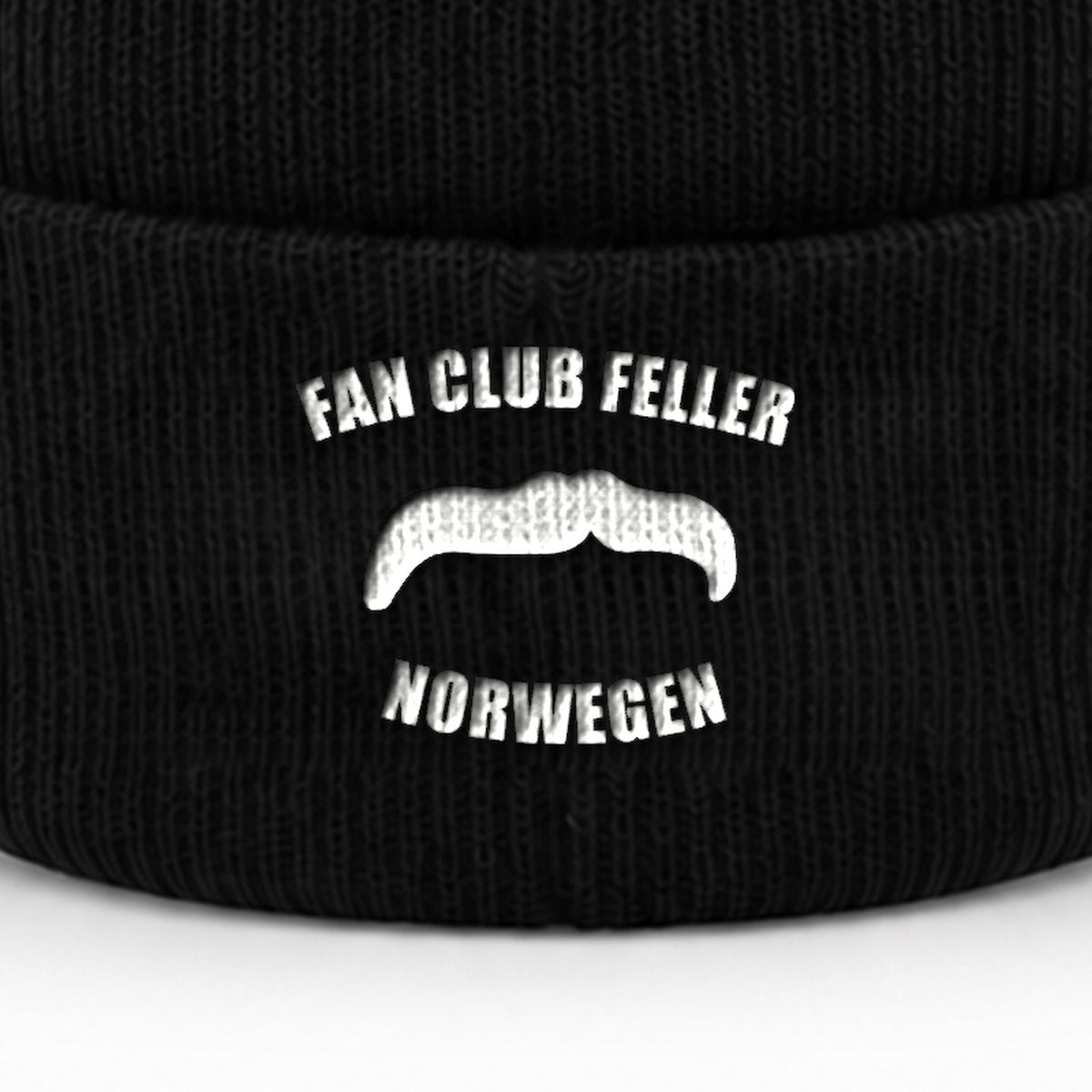 Manuel Feller Fan Club Norway Beanie in black with white Fan Club Feller Norwegen moustache logo – close-up of the embroidery