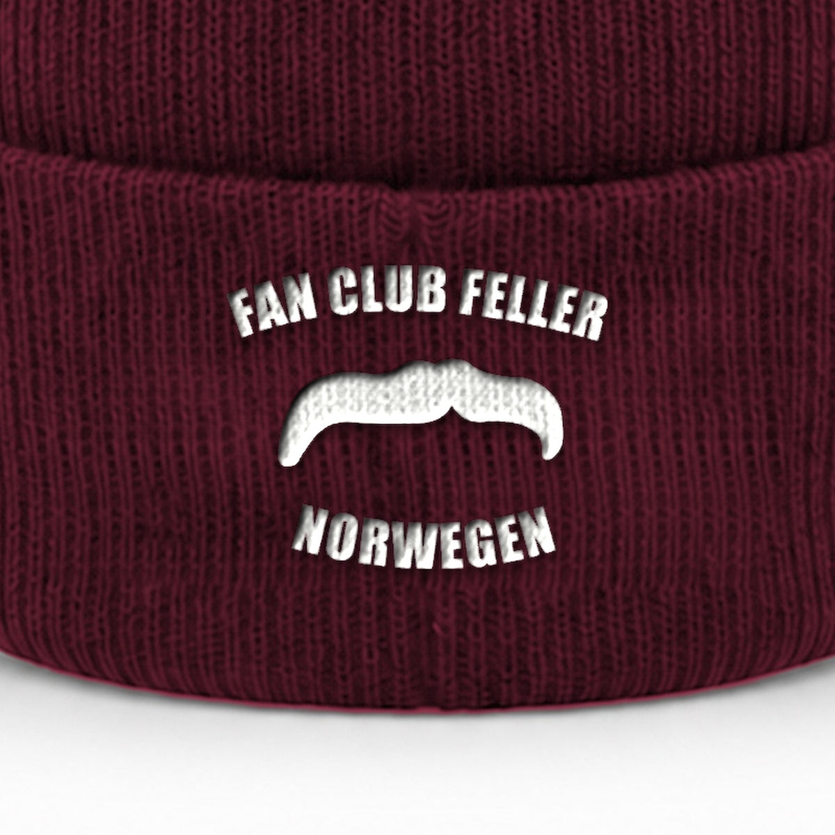 Manuel Feller Fan Club Norway Beanie in burgundy with white Fan Club Feller Norwegen moustache logo – close-up of the embroidery