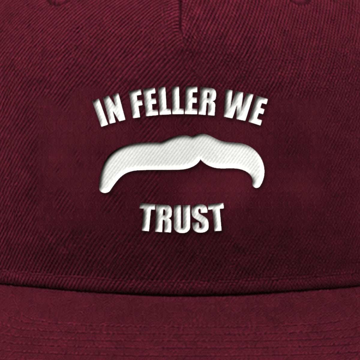 Manuel Feller In Feller We Trust Cap in burgundy with white "In Feller we trust" moustache motif – close-up of the embroidery